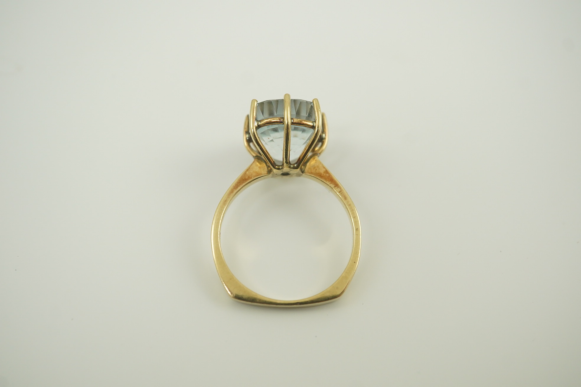 A 1970's 9ct gold and single stone oval cut aquamarine set dress ring